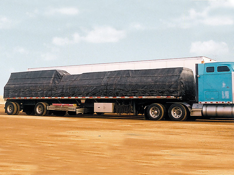 Flatbed with installed lumber tarps  Trucking Depot