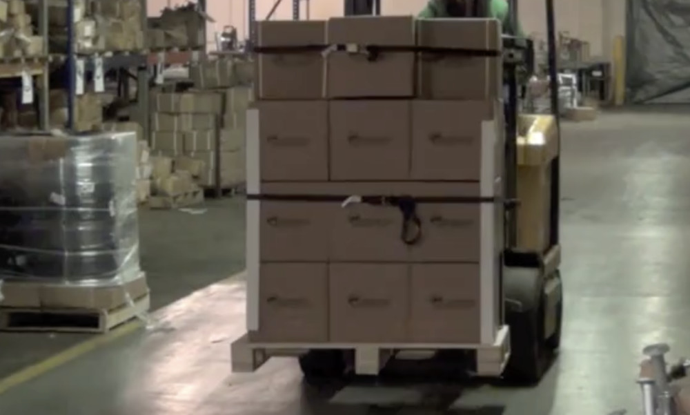 Endless Loop Ratchet Straps Around Pallet of Boxes On Forklift Trucking Depot