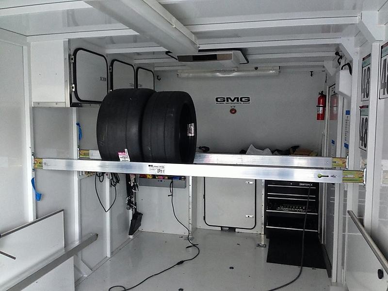 E Track Shoring Bars In Use Holding Racecar Tires Inside Enclosed Trailer  Trucking Depot