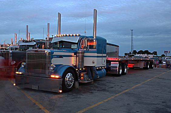 Flatbed trailer that is unloaded and getting ready for storage