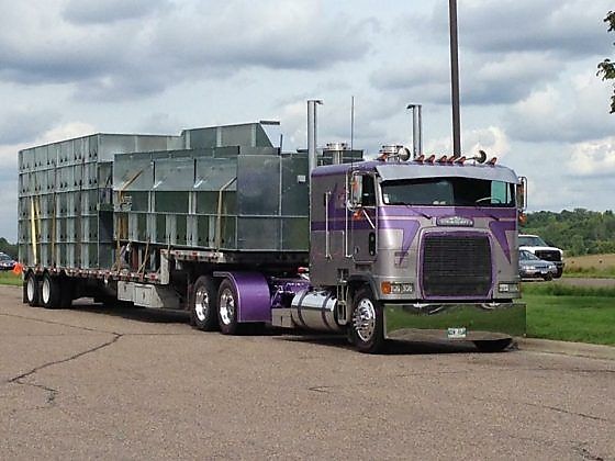 Flatbed Trailer Carrying Building Materials with Winch Straps