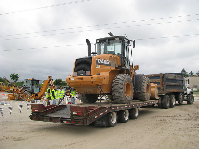 Flatbed Trailer Securing Heavy Machinery