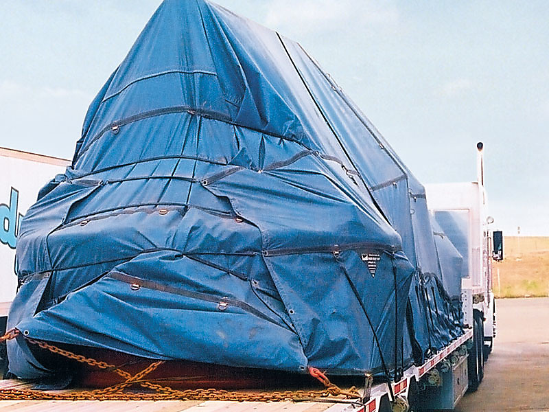 Flatbed Tarp System Installed on Flatbed Trailer protecting cargo