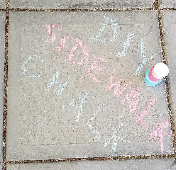 chalk words on sidewalk