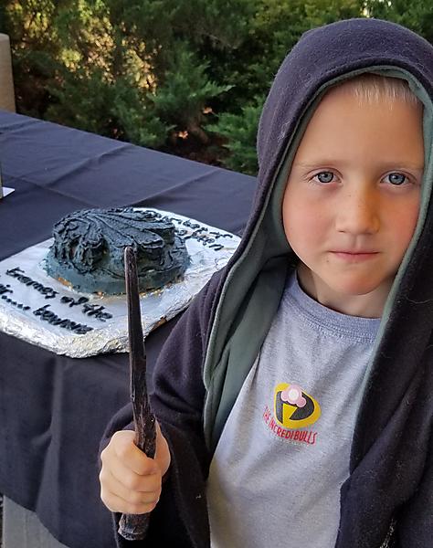 Edible Chamber of Secrets book with child wizard