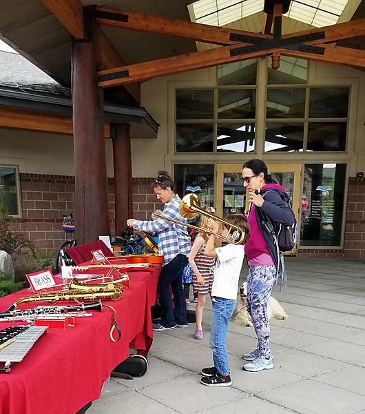 People trying out musical instruments