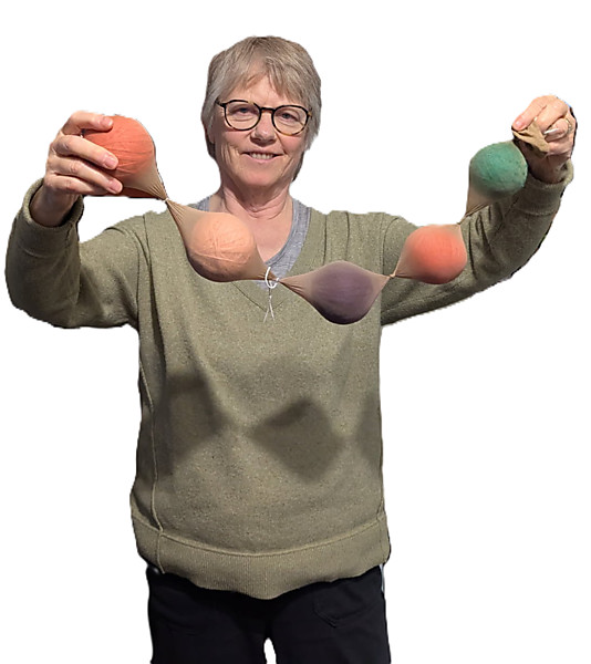 Woman holding DIY dryer balls