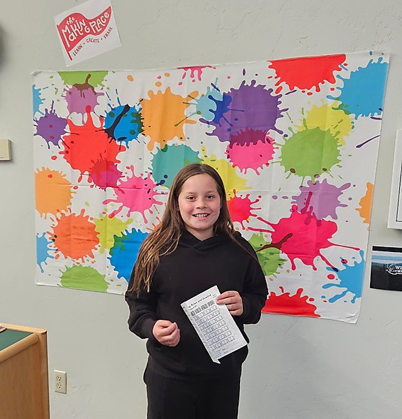 Girl in front of Making Place banner